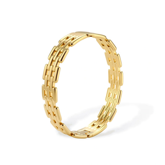 Wide 18K gold plated stainless steel bracelet with a multi-row rectangular grid link chain pattern on a cream background.