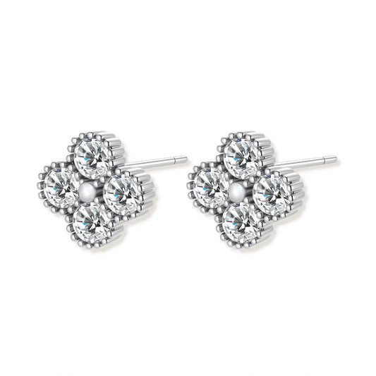 Dainty sterling silver quatrefoil stud earrings with four brilliant moissanite stones and center accent on white background.