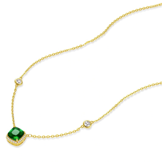 Delicate gold chain necklace featuring square emerald pendant with crystal halo and station accents