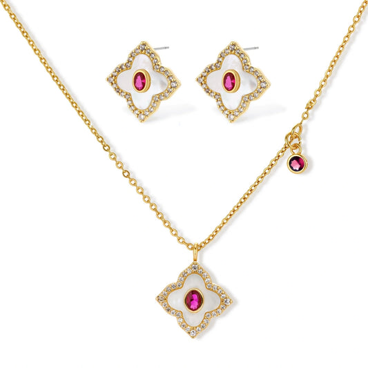 Gold-plated quatrefoil necklace and earring set with white enamel, pink cubic zirconia centers, and crystal borders