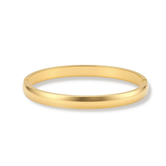 Polished 18K gold plated stainless steel hinge bangle with smooth flat-top profile on cream background.