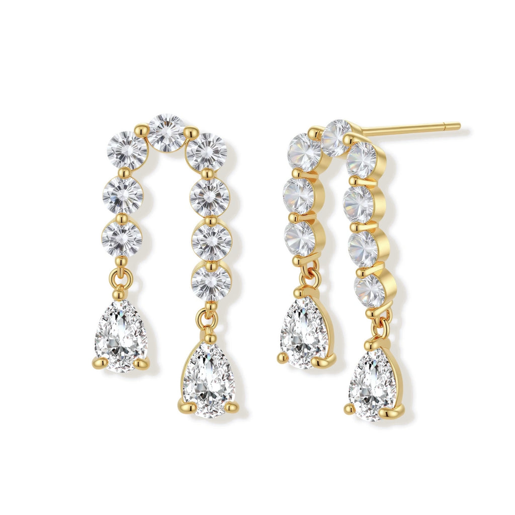 Gold-plated earrings with vertical line of clear crystals and teardrop pendants on neutral background