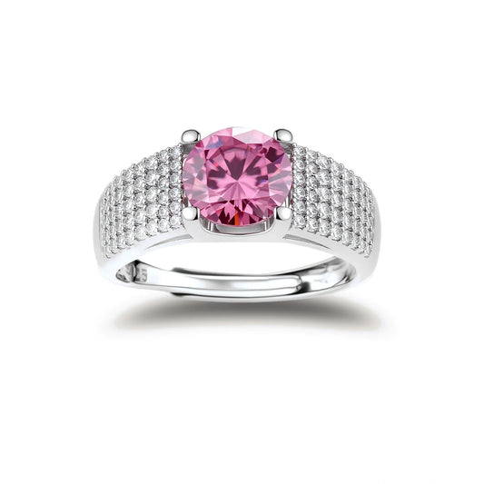 Sterling silver jewelry set featuring pink moissanite stones in halo settings on white background.