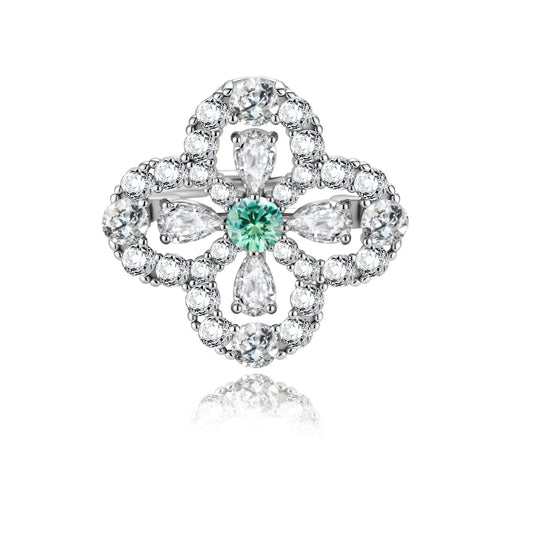 Sterling silver adjustable ring featuring four-leaf clover design with green center moissanite and clear accent stones