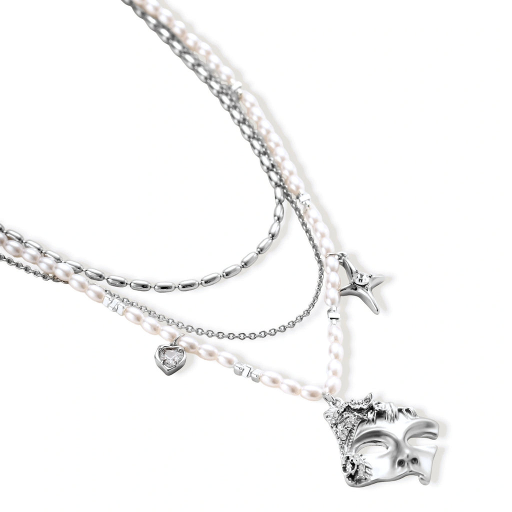 Multi-strand layered necklace set with silver chains, white pearls, star charm, heart pendant, and ornate decorative piece