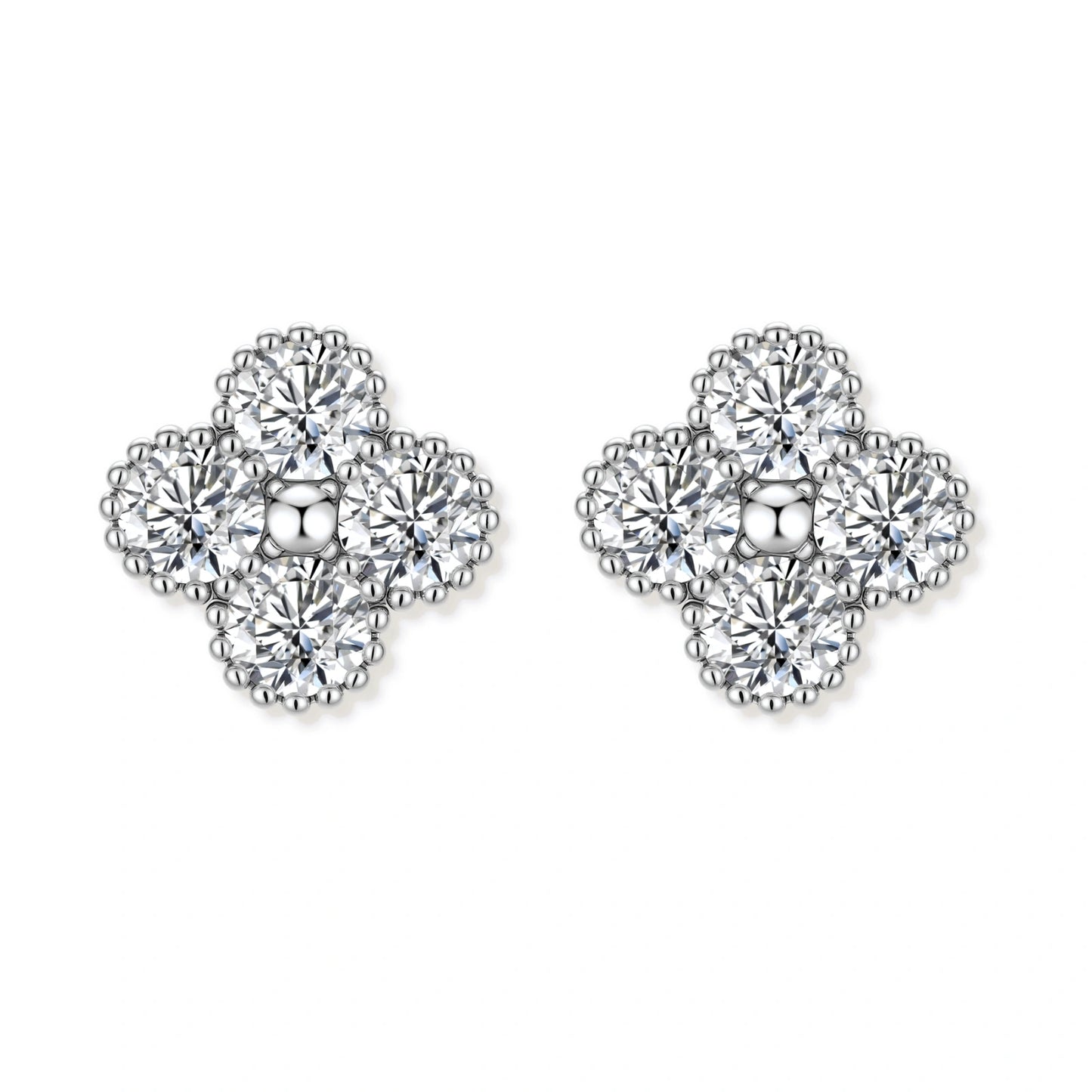 Dainty sterling silver quatrefoil stud earrings with four brilliant moissanite stones and center accent on white background.
