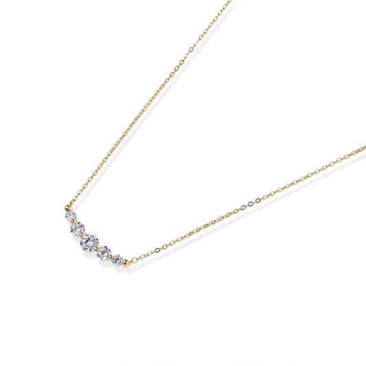 Delicate 14K gold-plated necklace with five graduated zirconia stones arranged in a curved arc on fine chain
