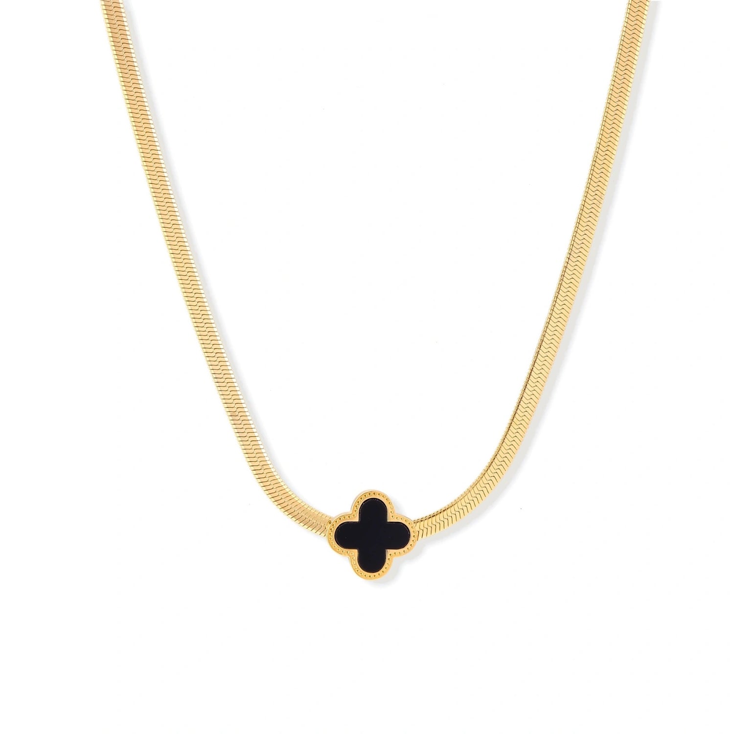 Dainty 18K gold-plated herringbone chain necklace with black enamel quatrefoil clover pendant on white background