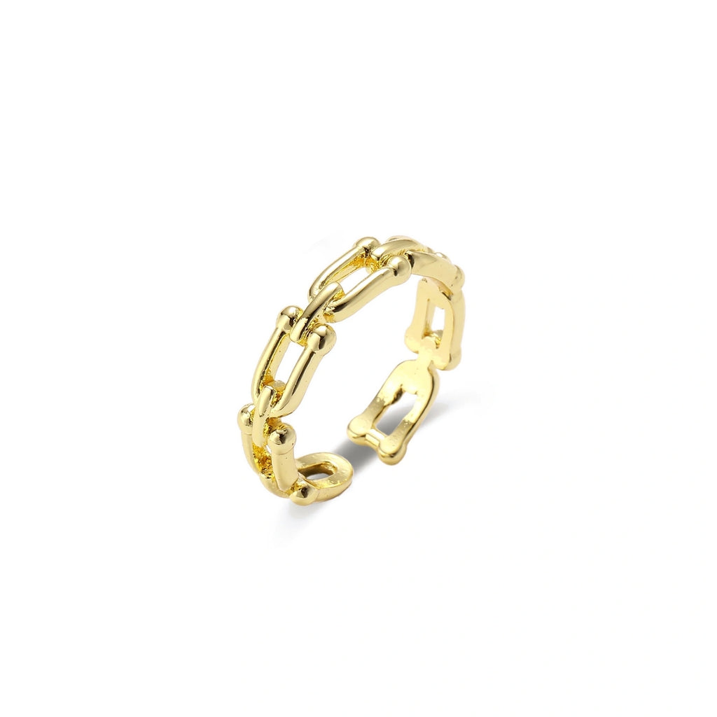 Two adjustable gold rings: chain-link band and halo-style ring with cubic zirconia stones on cream background