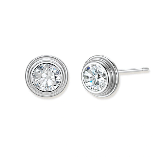 Close-up of sterling silver stud earrings featuring concentric circular frames with brilliant moissanite centers