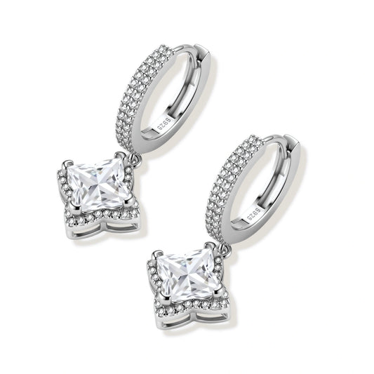 Sterling silver huggie hoops with geometric diamond-shaped moissanite dangles featuring pavé crystal details