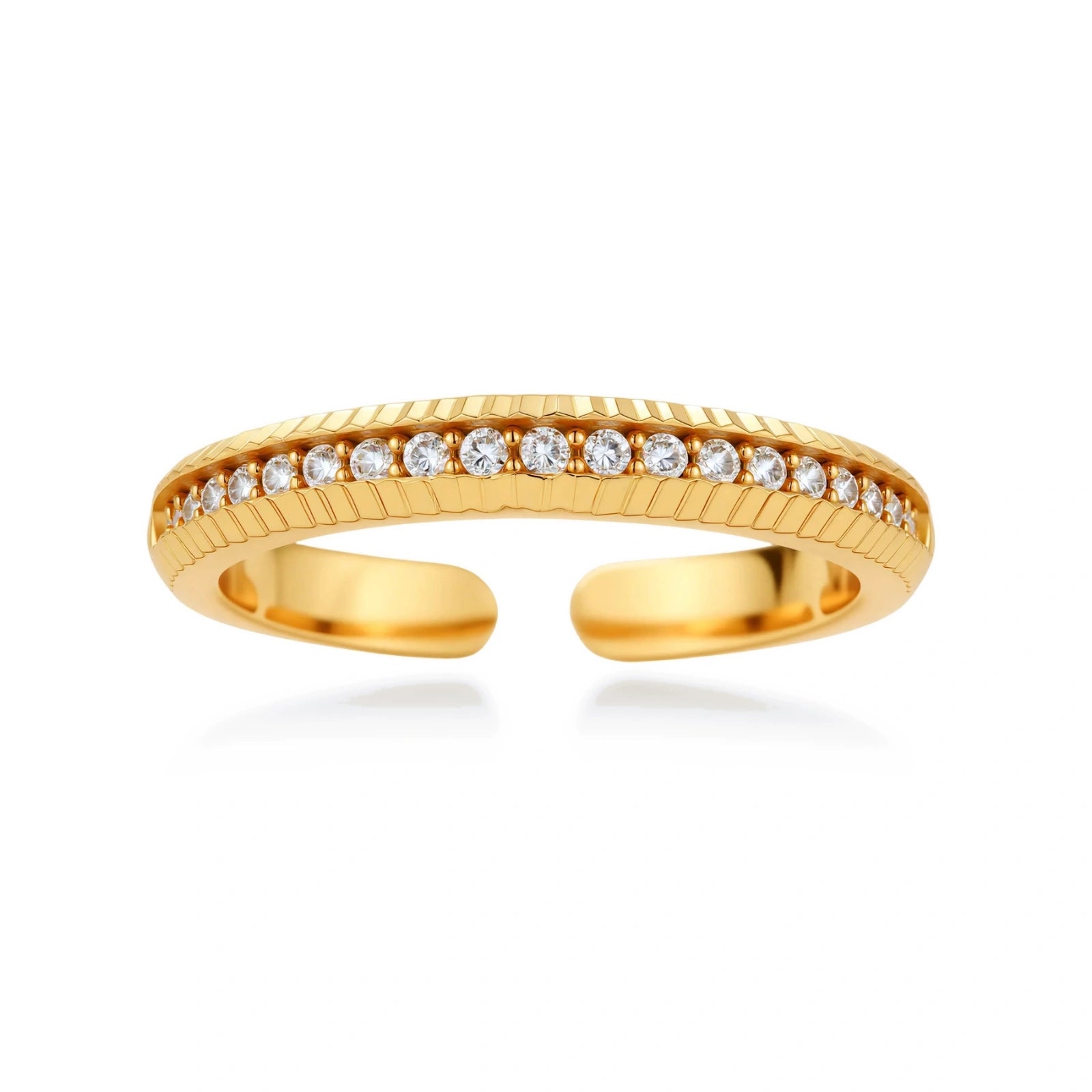 Adjustable gold-plated ring with row of sparkling crystals on ribbed band, shot against cream background