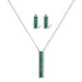 White gold plated jewelry set with emerald green rectangular stones and clear crystals in geometric rows on white background.