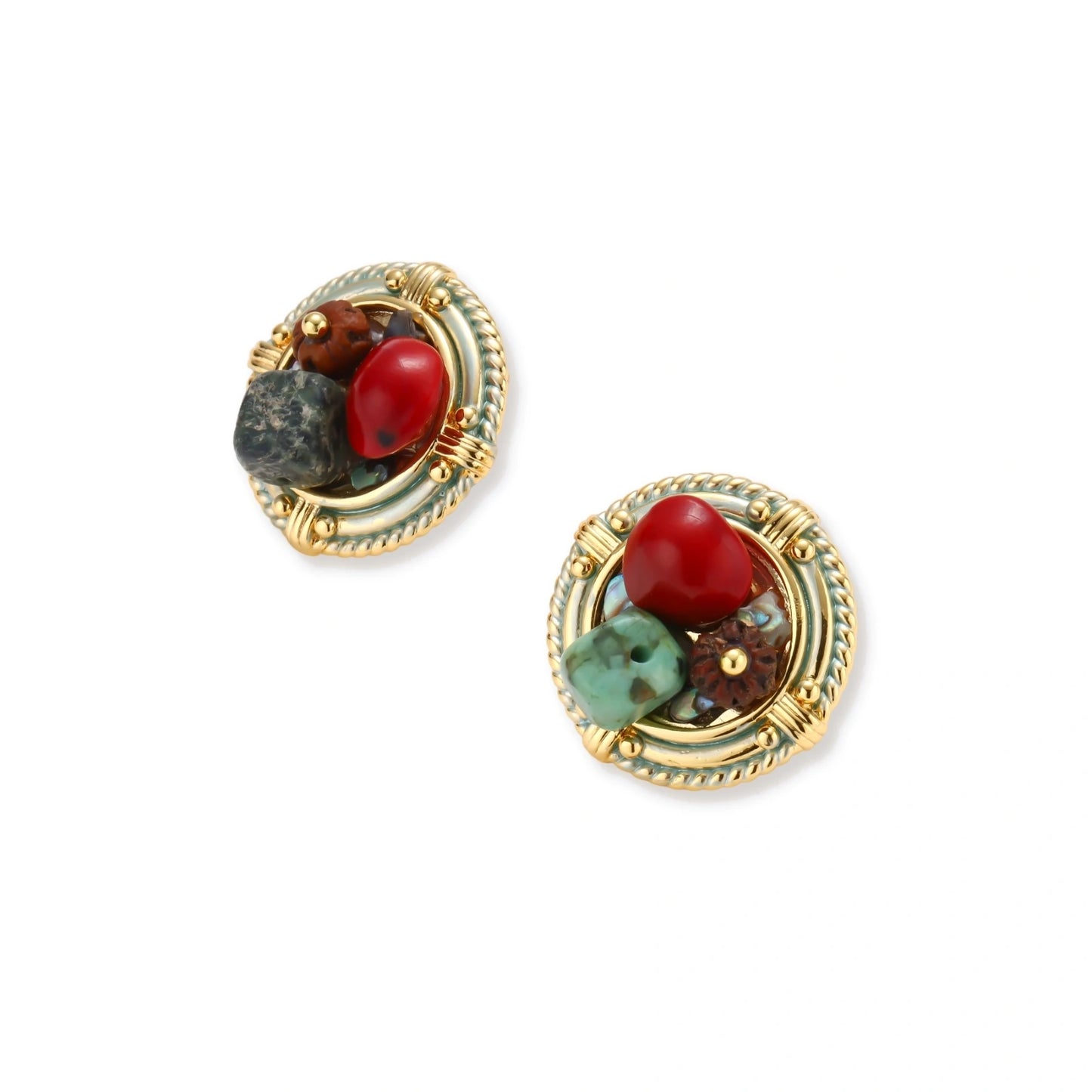 Circular gold-plated earrings with turquoise, coral, wood beads, and rope border detail on cream background.