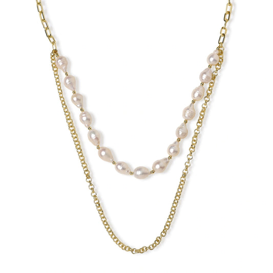 Layered gold chain necklace with organic baroque freshwater pearls and adjustable length on cream background
