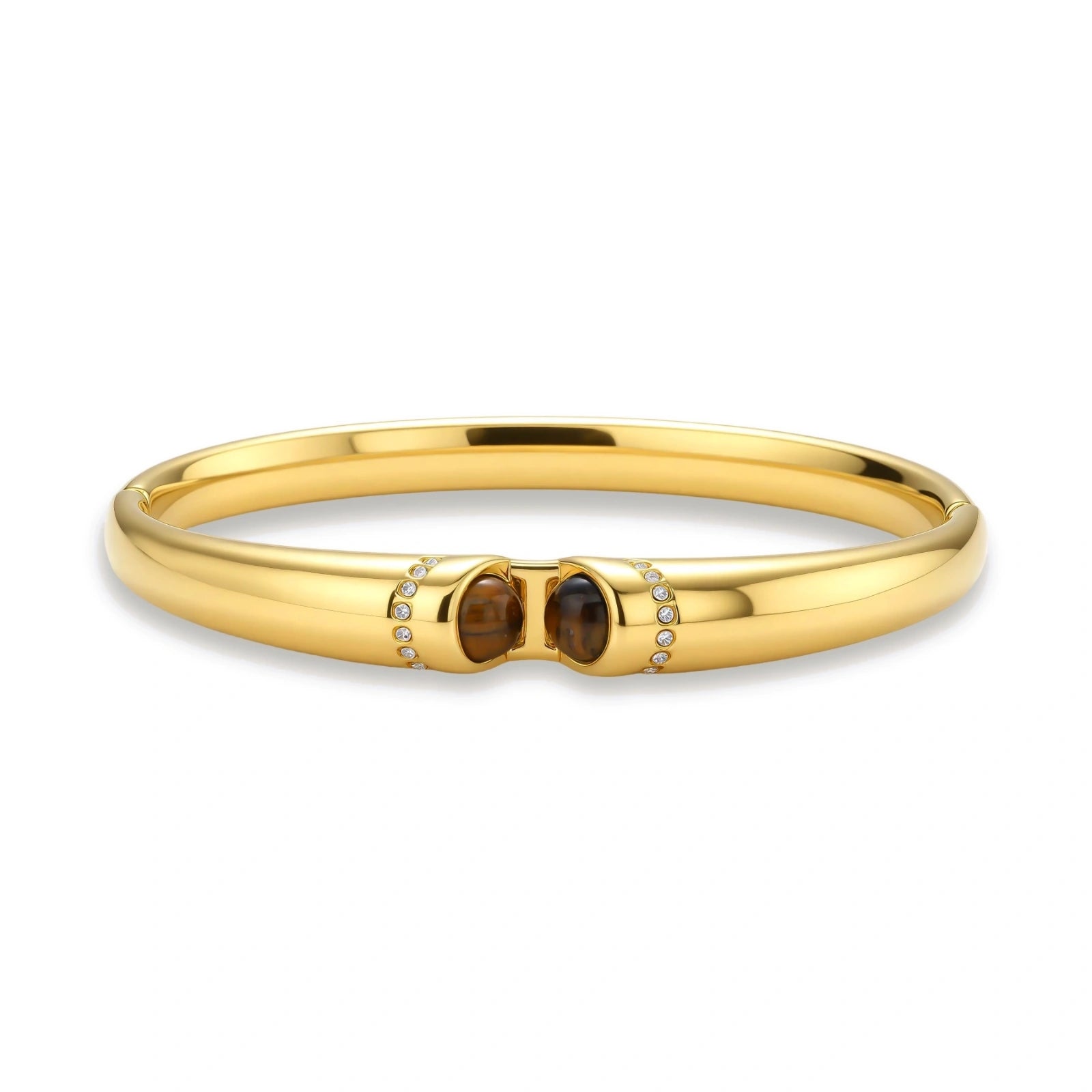 Polished gold bangle with two oval tiger's eye cabochons flanked by pavé diamond accents at center clasp.