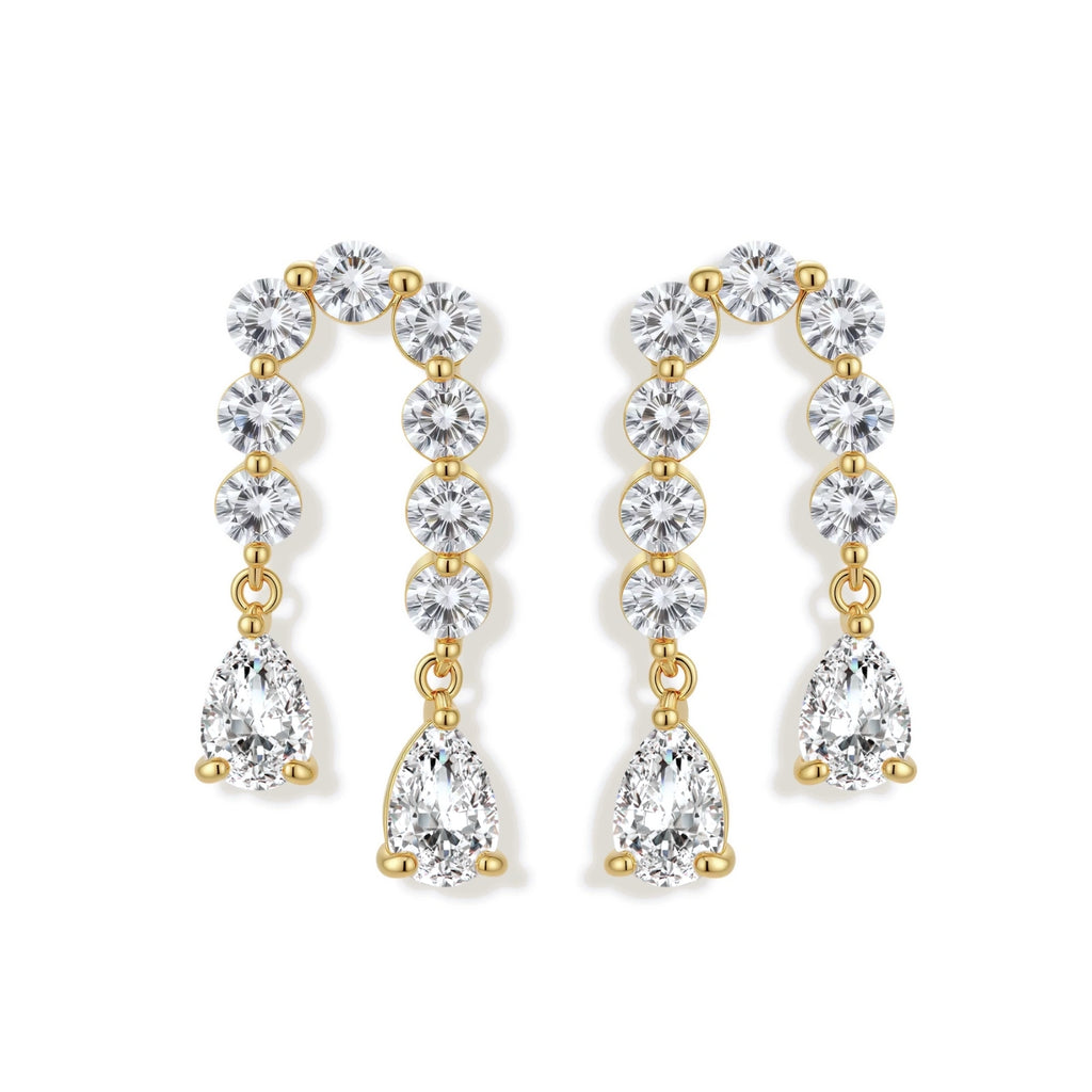 Gold-plated earrings with vertical line of clear crystals and teardrop pendants on neutral background