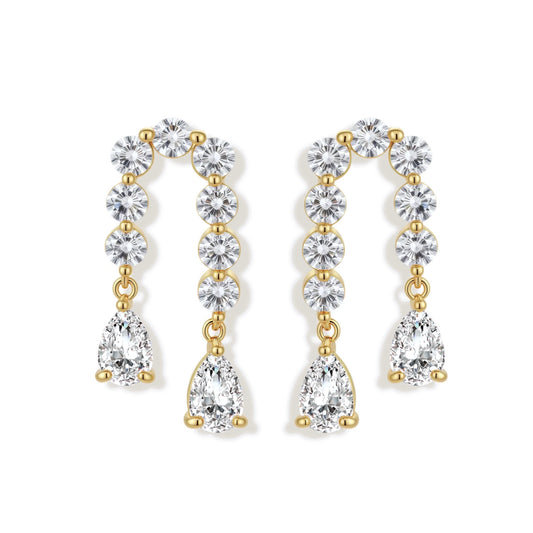 Gold-plated earrings with vertical line of clear crystals and teardrop pendants on neutral background