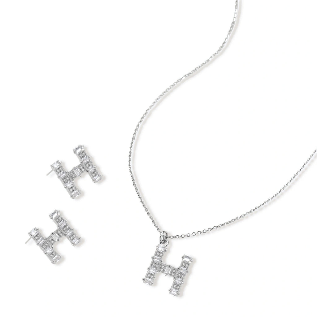 Letter H jewelry set featuring geometric crystal design in gold and white gold plated finish with adjustable chain necklace