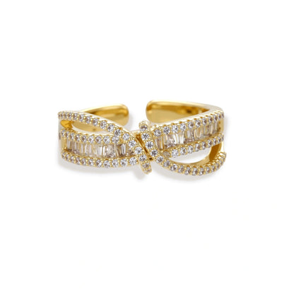 Close-up of gold-plated adjustable ring with crossing bands and sparkling zirconia stones on white background.