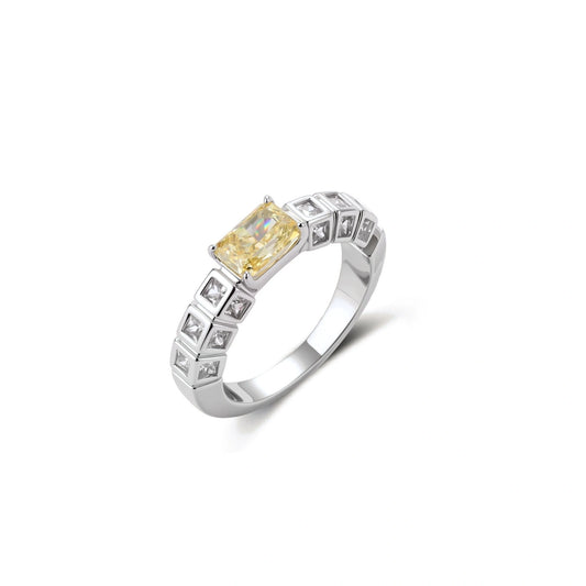 Adjustable ring with emerald-cut yellow zirconia center and clear accent stones in geometric platinum-plated setting