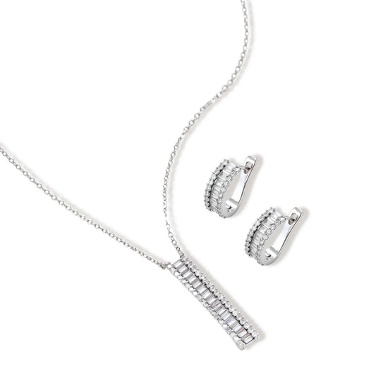 White gold plated necklace with vertical cubic zirconia pendant and matching hoop earrings on neutral background