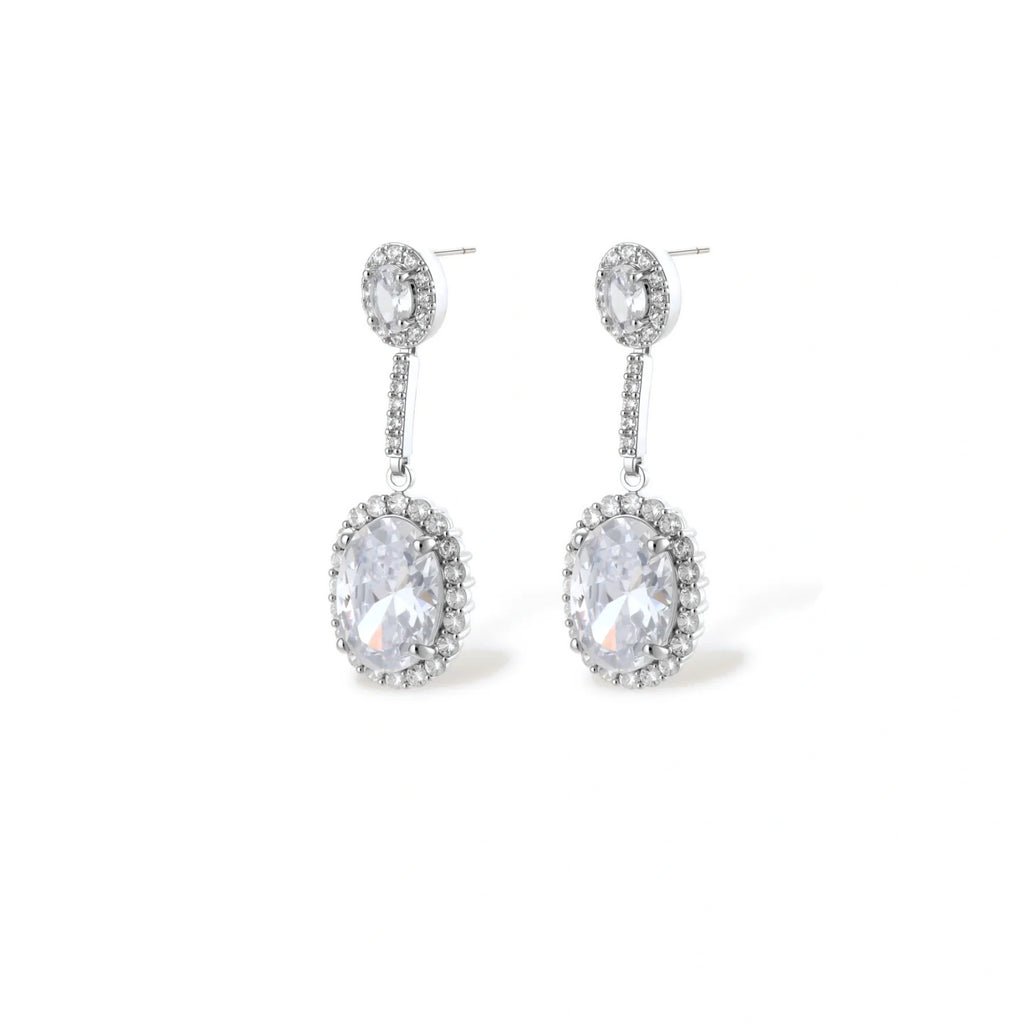 Elegant white gold plated jewelry set with oval cubic zirconia stones in halo settings, featuring Y-necklace and drop earrings.